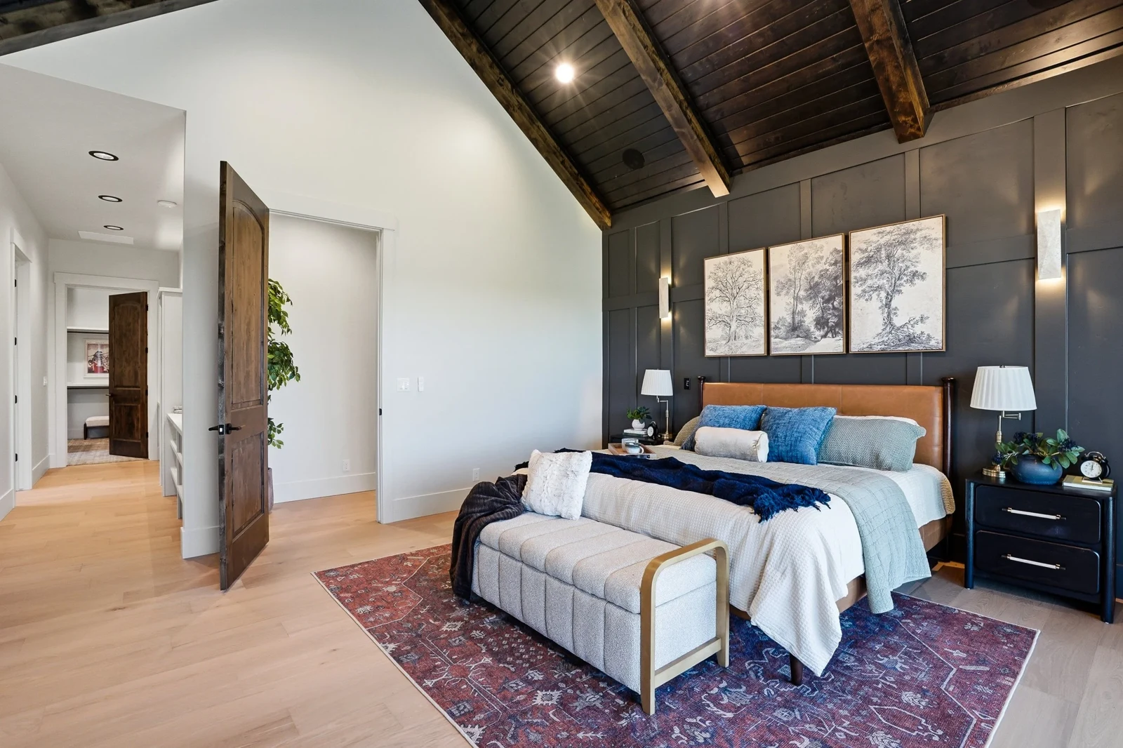 Primary bedroom with a timber ceiling and upholstered bed